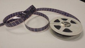 A roll of 16mm negative microfilm