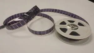 A roll of 16mm negative microfilm