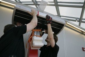 Service Technicians, Corin Van de Griek and Joe Preston installing the head of a 14000 A0 at the Joe and Rika Mansueto Library at the University of Chicago.