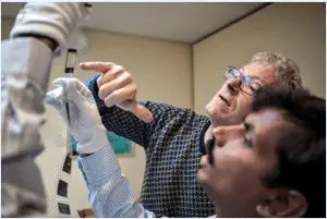 Digitization experts examine the microfilm images before scanning. 