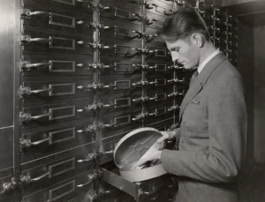 Glenn C. Henry of the Division of Motion Pictures and Sound Recordings in film storage area