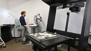 Travis Taylor sets up Baylor University's newest scanner the OS HQ for their long-term cassette tape project.